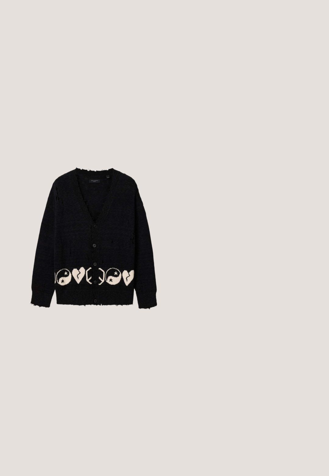 Cardigan noir boutonné avec des détails usés et un motif blanc de symboles yin-yang et de cœurs brisés sur l’ourlet inférieur.; Chemise blanche à manches longues avec col et petit logo Tommy Jeans sur la poitrine gauche.; Pantalon en velours côtelé beige clair avec une coupe droite, doté d'une fermeture à un bouton noir et d'une texture côtelée subtile. Pas de poches visibles.; Mocassin en daim beige avec semelle blanche, bout arrondi et détails cousus, conçu pour un port décontracté ou semi-formel, présenté en profil latéral.; Nœud papillon en soie beige avec une finition texturée et une forme plate, attaché à une bande noire réglable pour un port sécurisé.; Ceinture en cuir noir roulée avec plusieurs trous et une grande boucle métallique argentée rectangulaire.