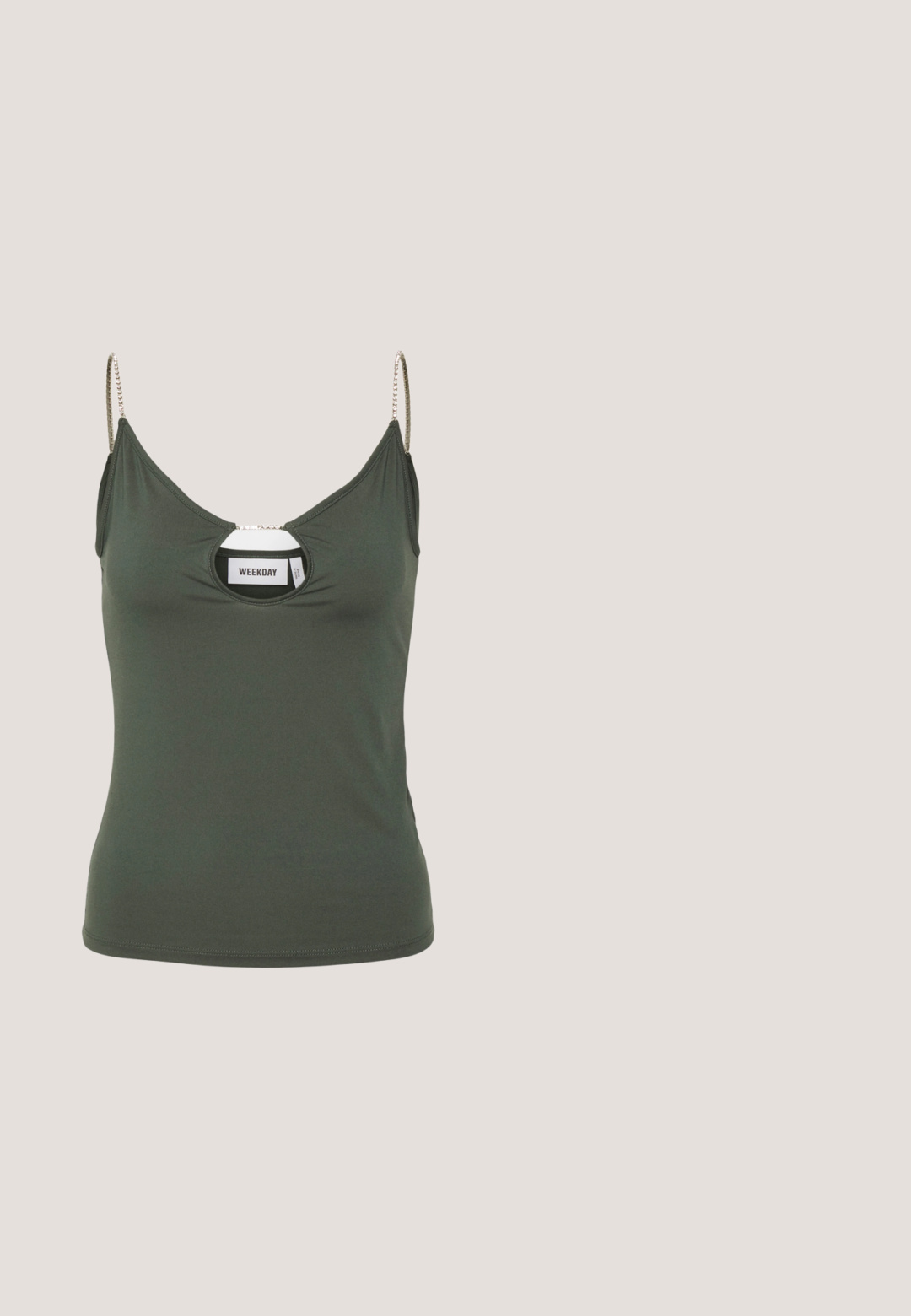 Weekday CLEAR RHINESTONE - Top - grey green; Zwarte wijde broek gemaakt van katoenen stof. Voorzien van een elastische tailleband en een gladde, gestructureerde afwerking. Geen zichtbare patronen of accenten.; Zwarte canvas instapschoen met een witte rubberen zool, voorzien van elastische zijkanten en contrasterende stiksels. Merkenlogo zichtbaar aan de zijkant.; Een paar rechthoekige zonnebrillen met lichtblauwe doorzichtige monturen en donkergrijze glazen, met rechte pootjes en minimale hardwaredetails.; Zwarte stoffen schoudertas met een zachte, gestructureerde oppervlakte, ronde vorm en een enkele strap. Minimalistisch ontwerp zonder zichtbare hardware of accenten.; Zilveren hoop oorbellen hebben een glad, rond ontwerp met een dun profiel en een veilige sluiting. Minimalistische stijl met een gepolijste afwerking.