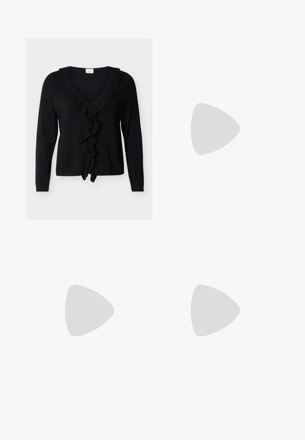 Sort cardigan med lange ærmer, V-hals og flæsekant langs udskæringen og ned midt foran. Bindes i taljen for lukning.; Beige kordfløjlsskjorte med knapkrave, to brystlommer og lange ærmer. Har vertikale ribber og en subtil glans.; Røde shorts lavet af blonder med et zigzag mønster, der har en bølget kant og en elastisk talje for komfort.; Enkelt hvid spids slingback højhælet sko liggende på en skinnende, metallisk sølv tuftet overflade.