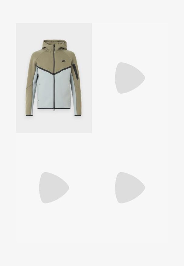 Nike-Kapuzenjacke mit Reißverschluss, olivgrün im oberen Bereich, hellgrau unten, schwarze Einfassung, Reißverschlusstasche am Ärmel und angenähter Kapuze, von vorne gezeigt.; Weißes ärmelloses Sporttop mit perforiertem Stoff und violett stilisiertem „N7“-Logo sowie Nike-Swoosh auf der Brust.; Weiße Sportshorts mit einem schwarzen Bund, mit einem lila abstrakten Muster am linken Bein und einem lila Nike-Logo am rechten Bein.; Schwarzer Nike Shox Laufschuh mit weißem Swoosh-Logo, in der Luft über einer rosafarbenen Betonfläche vor einem grauen Steinmauer-Hintergrund.