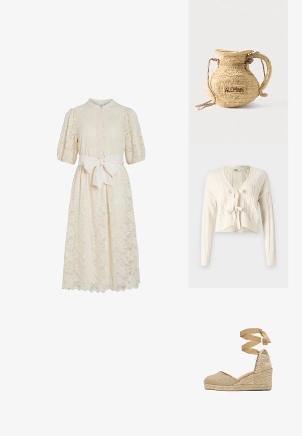 Cardigan court en tricot couleur écru, avec un col en V, des motifs en câble et une fermeture à nouer à l'avant. Texture douce avec des manches longues.; Robe en dentelle blanc cassé avec un col haut, des manches courtes bouffantes, un devant à boutons et une ceinture en tissu. Ourlet découpé détaillé avec des motifs floraux.; Chaussure compensée espadrille beige avec semelle en jute tressé et bride à nouer autour de la cheville, empeigne en tissu texturé et bout fermé.; Sac à main rond en paille tissée avec une anse en corde et "ALEMAIS" brodé sur le côté en fil marron.