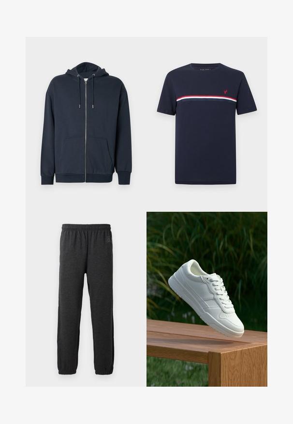 Marineblauwe zip-up hoodie gemaakt van een zachte katoenmengeling met een afgeronde zoom, twee steekzakken aan de voorkant en een verstelbare capuchon met trekkoord.; Navyblauw T-shirt met korte mouwen en rode, witte en donkerblauwe horizontale strepen over de borst, met een klein rood vogel-logo aan de linkerkant.; Grijze sweatpants van zacht materiaal, met een elastische tailleband en taps toelopende benen met elastische boorden. Subtiele logo-detail op een been.; Witte leren sneaker met een gladde textuur, voorzien van een geperforeerd ontwerp, klassieke vetersluiting en rubberen zool, gepositioneerd boven een houten oppervlak.