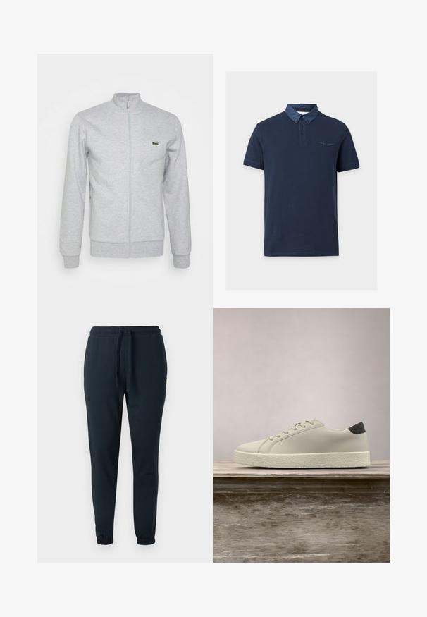 Hõbehallist pehme materjalist lukuga jope, millel on slim-fit krae ja soonikkoes varrukad. Vasakul rinnal on väike roheline logo.; Tumesinine lühikeste varrukatega polo särk, millel on täpiline tumesinine krae ja sobiva täpilise äärega rinnatasku klapil.; Tumerohelised puuvillasegusega dressipüksid, millel on elastne vöökoht paelaga ja pahkluude juures soonikud. Väike kollane logo detail.; Valge toss musta kannajoontega tekstuurse tallaga, hõljumas puidust pinki kohal, kus taustal on kõrge roheline muru.