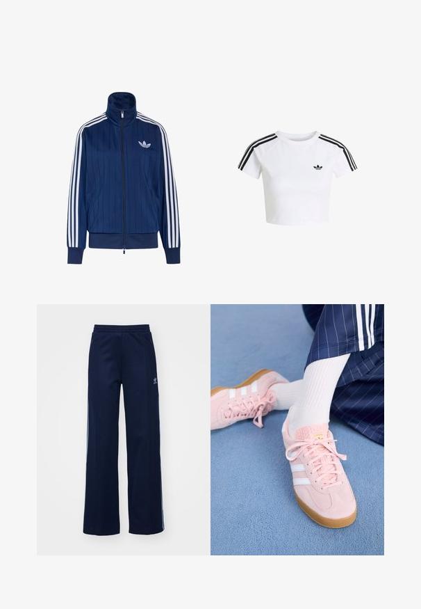 Navyblauwe trainingsjas met rits, witte drie strepen op de mouwen en wit trefoil-logo op de linkerborst, geribde boorden en zoom.; Witte cropped t-shirt met zwart Adidas trefoil-logo op de borst en drie zwarte strepen langs de schouders en mouwen.; Marineblauwe katoenen joggingsbroek met een brede pijpdesign, elastische tailleband en ritszakken, voorzien van witte zijstrepen en logo-detail.; Lichtroze suède sneakers met witte strepen en veters, voorzien van een gestructureerde tong en een gumzool, geplaatst op een blauwe tapijt.