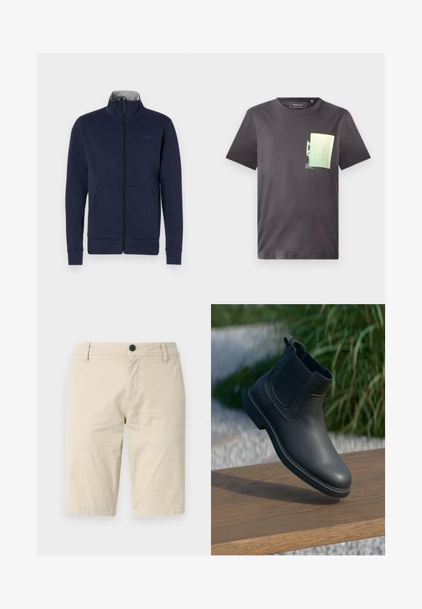 Marineblauwe ritsjack van zacht materiaal, met een staande kraag, twee voorzakken en geribde boorden en zoom. Subtiele logo-details op de borst.; Grijs katoenen T-shirt met een ronde hals, voorzien van een minimalistische groene en blauwe grafische print op de linkerkant van de borst. Korte mouwen.; Beige shorts van lichtgewicht stof, met een vlakke voorkant, een enkele knoopsluiting en twee zijzakken; gladde textuur.; Zwarte leren enkellaars met elastische zijkanten, gestructureerde accenten en een rubberen zool; de display heeft een houten oppervlak en groenereien.