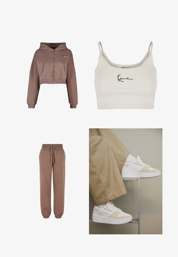 Geknipte, rits-hoodie van gedempt bruine stof. Heeft een voorkantzak, geribbelde zoom en bijpassende geribbelde manchetten. Sportlogo op de bovenste linkerkant.; Lichtbeige cropped top met dunne bandjes en een aansluitend design. Heeft een geborduurd zwart handtekening op de voorkant. Soepele textuur en rekbare stof.; Karl Kani SMALL SIGNATURE ESSENTIAL - Trainingsbroek - taupe; Witte sneakers met beige accenten gedragen met beige broek, voeten rustend op een minimalistisch metalen frame tegen een neutrale achtergrond.