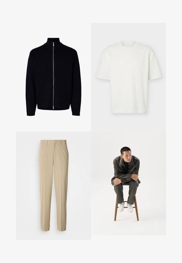 Sort langærmet lynlåstrøje med høj krave, sølvlynlås, der går fra hals til kant, enkel design, ingen synlige logoer eller mønstre.; Hvid tekstureret T-shirt med korte ærmer og rund hals med en almindelig pasform og et lille mærke indeni kraven.; Beige bukser med lige ben, lavet af et glat materiale, med en flad front og uden synlige lommer eller pynt.; Ung mand i mørk læderjakke og jeans sidder på en træskammel, læner sig fremad med armene krydset og kigger til siden mod hvid baggrund.