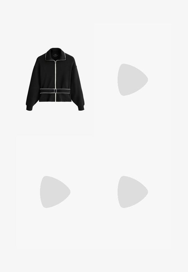 Veste noire à manches longues avec fermeture éclair, détails en biais blancs le long de la fermeture éclair, du col et de la ceinture de taille avec boucle.; T-shirt blanc uni à manches courtes et col rond, avec un ourlet droit, présenté sur un fond blanc.; Pantalons larges gris clair en tissu doux avec une taille élastique. Le design présente une coupe ample pour un confort et une liberté de mouvement.; Baskets Nike argent avec le swoosh et les lacets blancs, flottant au-dessus d'un muret en béton avec des escaliers flous en arrière-plan.