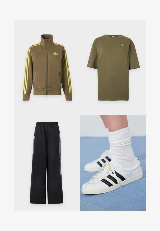 Olivovo zelená štýlová bunda na zips s vysokým golierom, žlté tri pruhy na rukávoch a žlté logo Adidas trefoil na ľavej strane hrude.; Krátke tričko olivovo zelenej farby s okrúhlym výstrihom a malým bielym logom Adidas trefoil na ľavej strane hrudníka.; Čierne široké teplákové nohavice s elastickým pásom a tromi bielymi pruhmi na boku každej nohavice.; Biele kožené tenisky s čiernymi pruhmi, krémovou podrážkou a svetlými šnúrkami. Nosené s bielymi rebrovanými ponožkami, umiestnené na modrom pozadí.