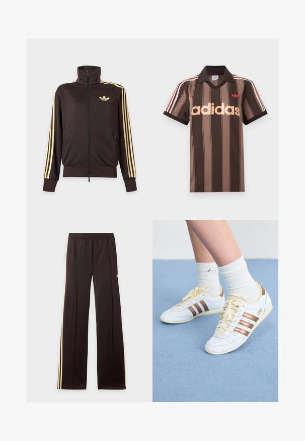 Zwarte joggingjas met rits en hoge kraag, lichtgele strepen op de mouwen en Adidas trefoil-logo op de linkerborst.; Bruine gestreepte Adidas polo met V-hals, bordeauxrode kraag en rood logo. Heeft witte en rode schouderstrepen, korte mouwen.; Zwarte trainingsbroek met gele zijstrepen, elastische tailleband, ritszakken aan de zijkant en een klein logo op het bovenbeen.; Witte sneakers met bronzen strepen, getextureerd leer, gele veters en geperforeerde details. Gedragen met witte geribbelde sokken op een zachte blauwe ondergrond.