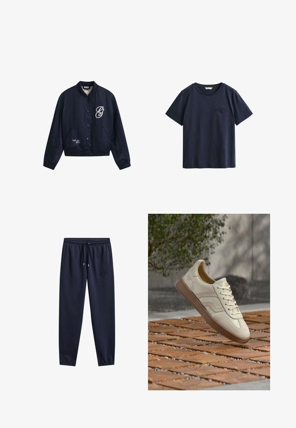 Cazadora bomber azul marino con botones, cuello, puños y bajo acanalados, con la letra "G" en blanco en el pecho y "With Love" cerca del bajo.; Camiseta de algodón azul marino de manga corta con cuello redondo y pequeño logo bordado de GANT en el pecho izquierdo.; Pantalones deportivos azul marino con cintura elástica, cordón, bolsillos laterales, piernas estrechas y un sutil logo bordado en el muslo derecho.; Zapatilla de color crema con suela de goma beige texturizada, diseño con cordones y sutiles detalles de marca en el lateral. Parte superior de cuero liso.