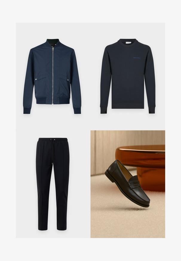 Marineblauwe bomberjack gemaakt van gladde stof, voorzien van een rits aan de voorkant, geribbelde kraag en boorden, en twee voorvakken met zilverkleurige details.; Marineblauwe crewneck-trui gemaakt van katoen. Voorzien van geribbelde manchetten en zoom, met de tekst "TIGER OF SWEDEN" in blauw op de borst.; Zwarte joggingsbroek van zacht, rekbaar materiaal. Beschikt over een elastische tailleband met trekkoord en taps toelopende pijpen. Geen zichtbare patronen.; Zwarte leren loaferschoen zwevend boven een beige tapijt met amberkleurige moderne meubels op de achtergrond.