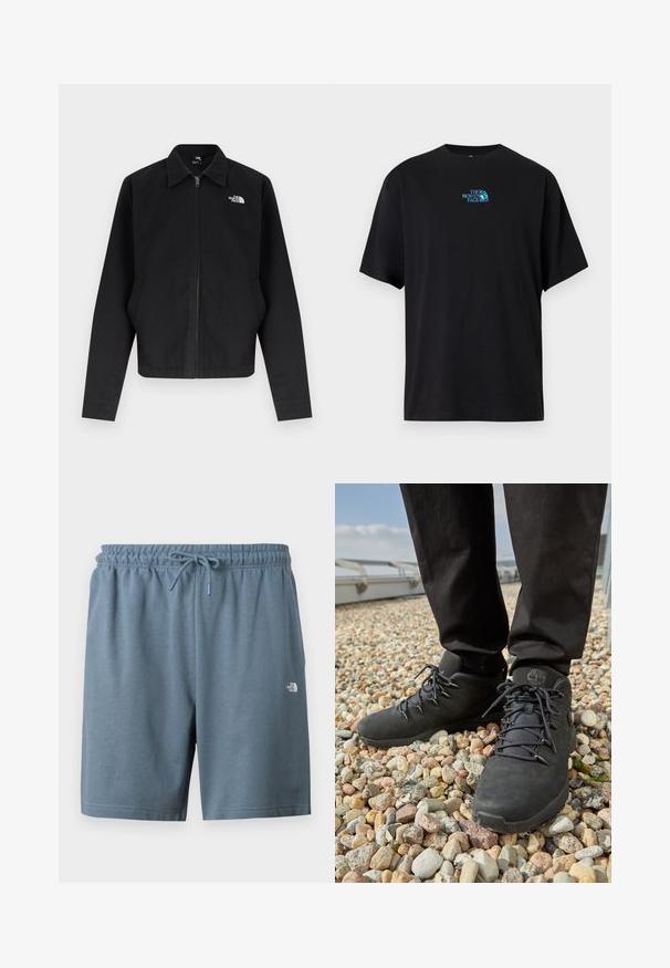 Veste noire à fermeture éclair avec col, manches longues, poches latérales, et logo blanc "The North Face" sur la poitrine gauche.; T-shirt en coton noir avec un col rond et des manches courtes, arborant un logo turquoise de "The North Face" sur la poitrine.; Shorts à taille élastique bleue avec cordon de serrage et petit logo blanc The North Face sur la cuisse gauche.; Chaussures de randonnée noires en cuir texturé, avec des lacets robustes et un col de cheville rembourré, portées avec un pantalon sombre sur une surface de gravier.