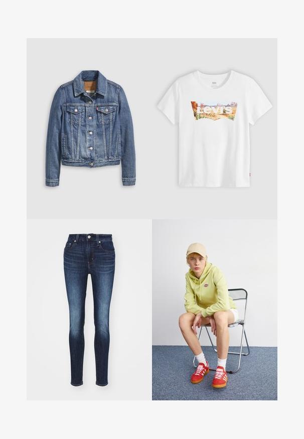 Spijkerjack in mediumblauw met een klassieke kraag, knopen aan de voorkant, twee borstzakken en goudkleurige accenten. Verweerde textuurdetails.; Witte Levi's T-shirt met woestijnlandschap en plantenafbeelding binnen het batwing-logo van het merk over de borst.; Donkerblauwe skinny jeans met een middelhoge taille, voorzien van een vervaagd patroon, vijf zakken en een metalen knoop en ritssluiting.; Lichtgroene hoodie met logo, witte shorts, rode sneakers met witte strepen, zittend op een chroom opvouwstoel tegen een neutrale achtergrond.