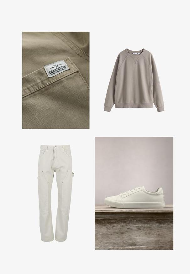 Khaki tkanina s textúrovaným povrchom, s bielou nášivkou na vrecku - text obsahuje "ESTD 1982," "STANDARD ISSUE" a referenciu na dodávku.; Béžová mikina s okrúhlym výstrihom, dlhými rukávmi, rebrovanými manžetami a lemom, s jemným prešitím na pleciach a hrudníku.; Svetlo béžové cargo nohavice z odolnej bavlny. Majú viacero vreciek, zapínanie na patentky a priamy strih nohavíc.; Biele šnurovacie tenisky sa vznášajú nad drevenou lavicou so zeleným porastom v pozadí, predvádzajúc design a textúru topánok.