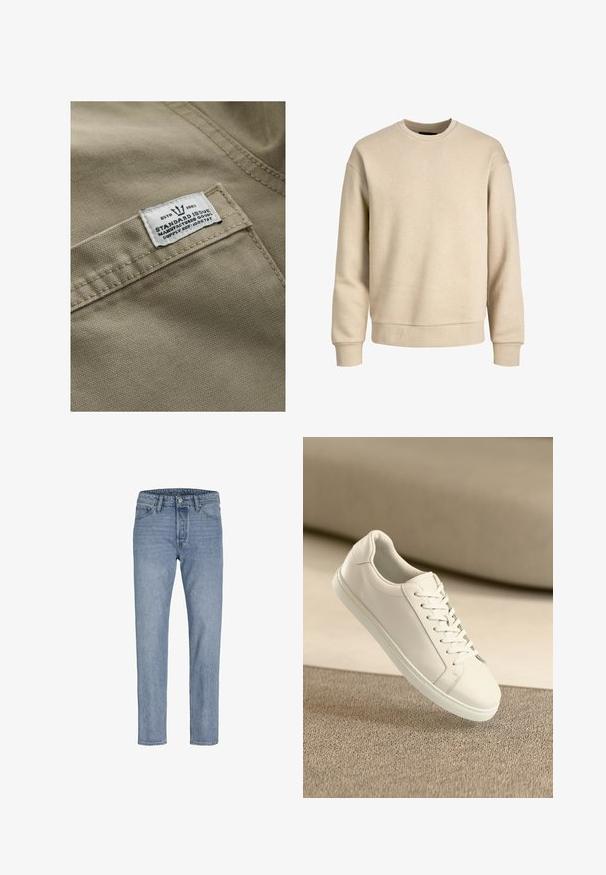 Khaki stof met een gestructureerd oppervlak, met een wit label op een zak genaaid—de tekst bevat "ESTD 1982," "STANDARD ISSUE," en een referentie voor de levering.; Beige sweatshirt gemaakt van zachte stof, met een ronde hals, lange mouwen en ribbelboorden en -zoom voor een ontspannen pasvorm.; Lichtblauwe spijkerbroeken met een recht gesneden pijp, vijf zakken, gestikte naden en een knoopsluiting bij de taille.; Witte leren sneaker met witte veters, weergegeven op een beige textuurovervlak en een zacht vervaagd achtergrond.