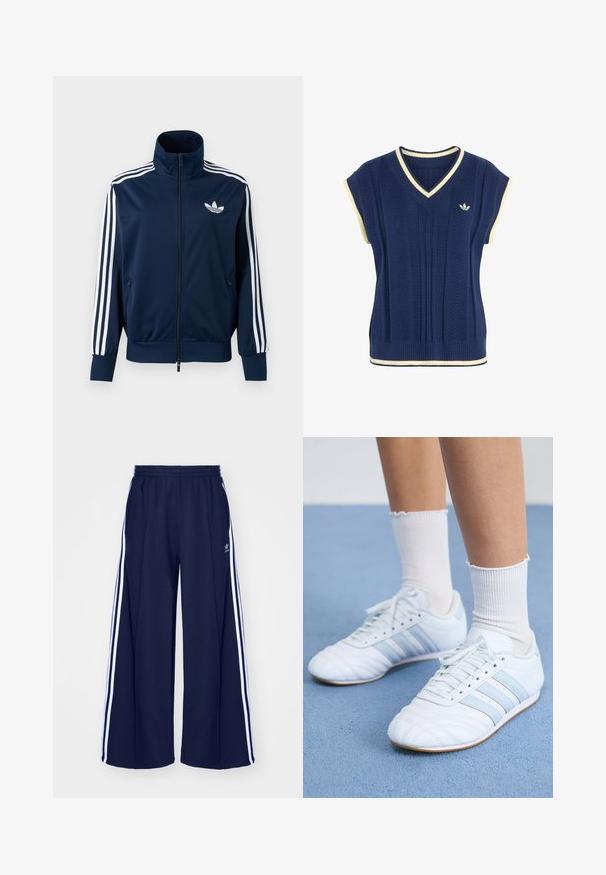 Marineblå Adidas trackjakke med hvide striber på ærmerne, fuld lynlås foran, høj krave og hvidt trefoil-logo på brystet.; Marineblå strikket ærmeløs sweatervest med hvid kant på V-hals, ærmegab og kant, med lille hvid Adidas-logo på brystet.; adidas Originals PANT - Træningsbukser - night indigo; Hvide lædersportssko med lyseblå striber, struktureret tåhætte og hvide ankelstrømper. Vist på en blå tæppeoverflade.