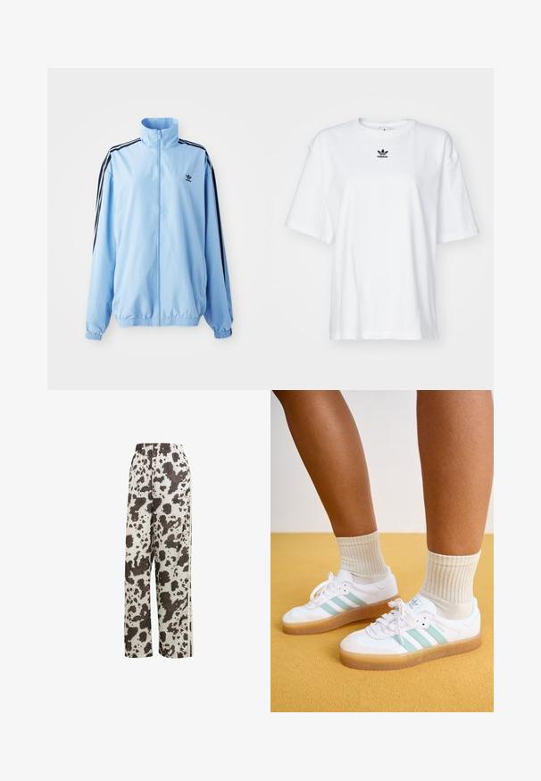 Lyseblå jakke lavet af nylon, med høj krave, sorte sidestropper, elastiske manchetter og et lille sort logo på brystet.; Hvid kortærmet t-shirt lavet af bomuld. Har en rund halsudskæring og et lille sort Adidas-logo på brystet. Lige skåret kant.; adidas Originals COW PRINT SATIN WIDE LEG - Træningsbukser - multicolor off white; Hvite sneakers med mintgrønne striber, gummisål og snørebånd, parret med ribbede cremefarvede sokker. Sat mod en gul baggrund.