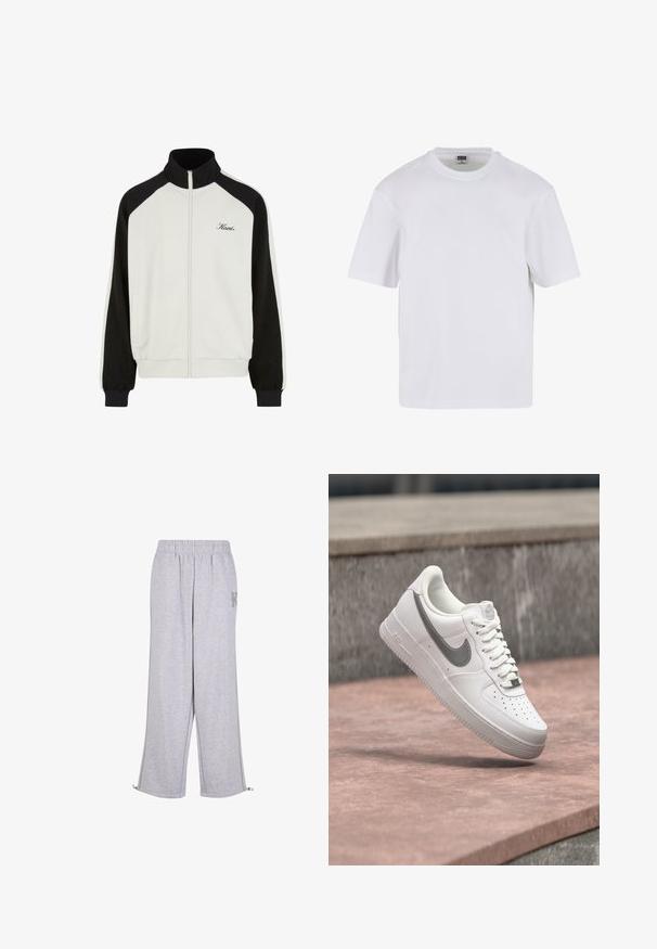 Veste zippée avec un corps blanc et des manches noires. Dispose d'un col haut, de poignets côtelés et d'un logo brodé sur la poitrine.; T-shirt blanc à manches courtes en coton. Il présente un col rond et une coupe décontractée. Texture lisse, design minimaliste, sans motifs ni accents.; Karl Kani Pantalon de survêtement - grey; Baskets blanches Nike Air Force 1 avec logo swoosh gris flottant au-dessus d'une surface en pierre et un mur en pierre gris en arrière-plan.