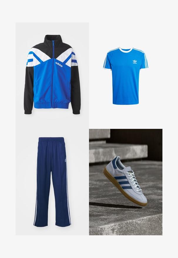 Chaqueta cortavientos azul y negra con patrón de chevron blanco y azul, cierre de cremallera, puños elásticos y bolsillos laterales. Logo de Adidas exhibido.; Camiseta de algodón azul con cuello redondo y dobladillos de mangas en blanco. Presenta tres franjas blancas clásicas a lo largo de los hombros; pequeño logo en el pecho.; Pantalones deportivos en azul marino con un corte relajado, que presentan franjas laterales blancas y una cintura elástica. Tejido suave, sin patrones visibles ni herrajes.; Zapatilla Adidas Spezial azul claro con rayas azul marino y suela de goma, mostrada en el aire sobre escalones de hormigón en un entorno exterior neutral.