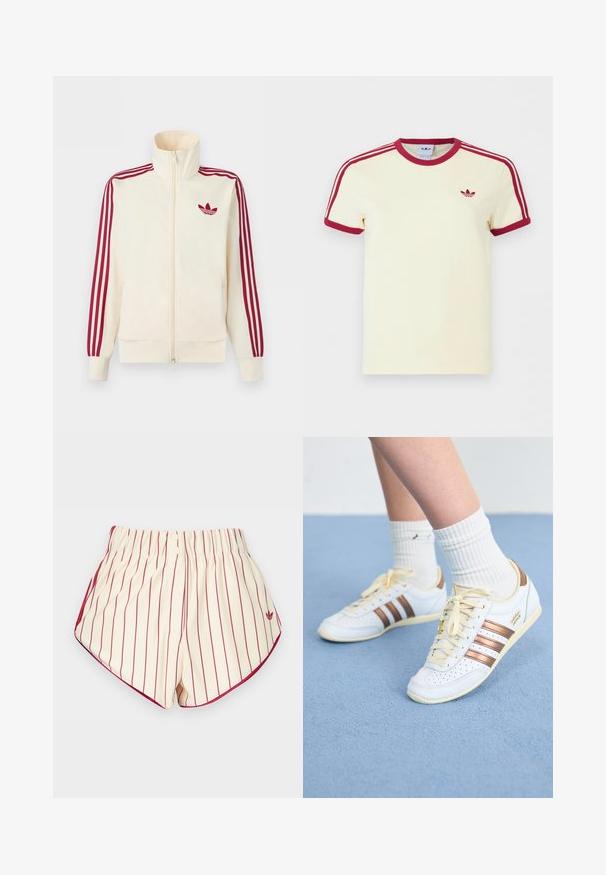 Roomkleurig trainingsjack met ritssluiting, rode drie-strepen op de mouwen en een rood Adidas trefoil-logo op de borst.; Crèmewit Adidas T-shirt met korte mouwen, rode geribbelde kraag, mouwuiteinden, drie rode strepen op de schouders en een rood Adidas trefoil-logo op de borst.; Crèmekleurige shorts met verticale rode strepen, een elastische tailleband, twee knopen aan de voorkant en een rode bies langs de afgeronde zoom.; Witte sneakers met bronzen strepen, getextureerd leer, gele veters en geperforeerde details. Gedragen met witte geribbelde sokken op een zachte blauwe ondergrond.