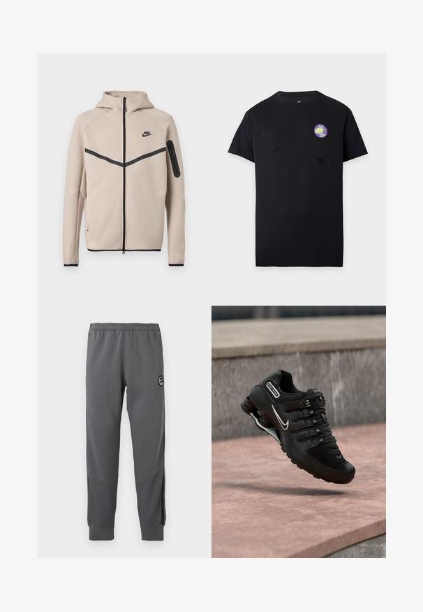 Beige Nike hættetrøje med fuld lynlås foran, sort chevronstribe over brystet og lynlåslomme på venstre ærme.; Sort T-shirt med korte ærmer med et lille rundt Nike-logo i lilla og grønt på venstre brystområde.; Grå sweatpants lavet af blødt stof med elastisk talje, tætsiddende ben, sidelommer og en cirkulær logo-patch.; Sort Nike Shox løbesko med hvid swoosh-logo, midt i luften over en rosa betonoverflade mod en grå stenmur som baggrund.