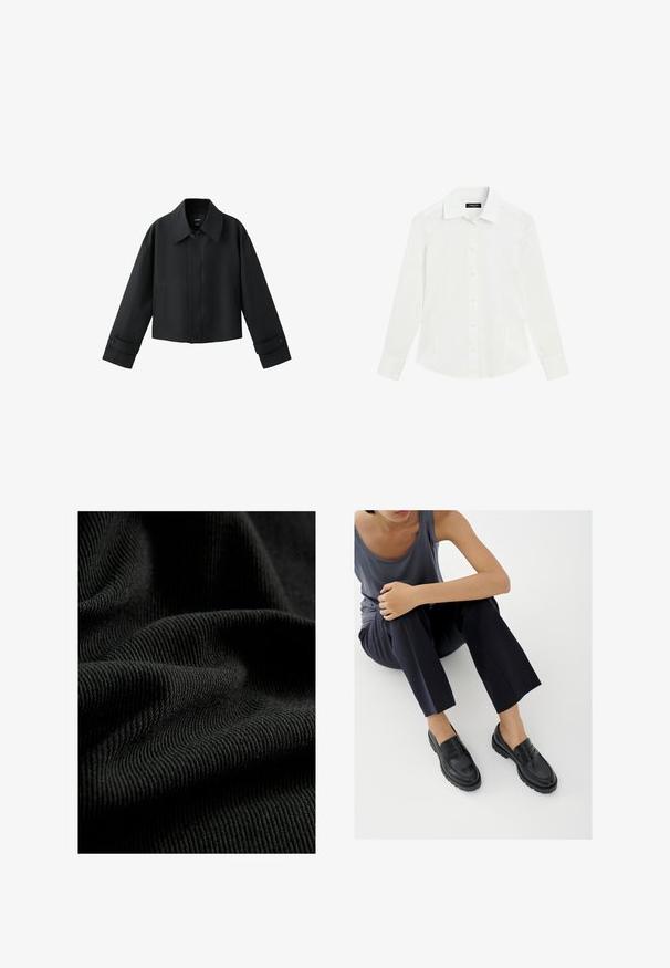 Veste courte noire avec col large, manches longues, poignets boutonnés et fermeture à boutons sur le devant.; Chemise blanche à manches longues avec col et poignets, présentée à plat sur fond blanc.; Tissu noir côtelé avec une surface texturée, mettant en valeur des plis et des courbes subtiles. Le matériau semble léger et flexible.; Mocassins en cuir noir avec accents texturés, talon bas, bout arrondi, et coutures visibles. Modèle portant un pantalon sombre et un haut gris.