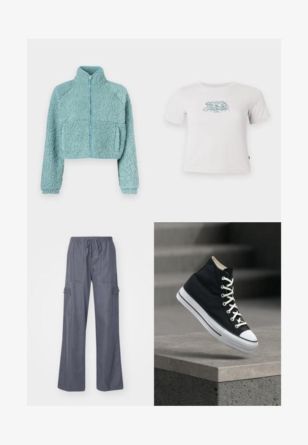 Veste zippée raccourcie en matériau bleu clair doux et texturé ; comprend des manches raglan et deux poches avant avec un bord contrastant.; T-shirt blanche courte à côtes avec des manches courtes et un petit motif floral vert centré sur la poitrine.; Pantalons cargo gris avec taille à cordon, jambes larges et deux poches latérales. Fabriqués en tissu doux et léger.; Baskets montantes noires avec lacets blancs et semelle en caoutchouc, en équilibre sur le bord d'une plateforme en béton gris.