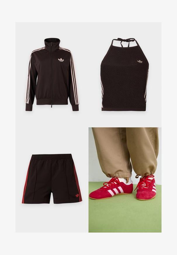 Zwart trainingsjack met rits, voorzien van roze drie gestreepte banen op de mouwen en een roze Adidas trefoil-logo op de linkerborst, opstaande kraag en zakken aan de voorkant.; Zwarte mesh halter crop top met een textuurpatroon. Voorzien van roze accentstrepen en een klein logo aan de voorkant. Sluiting met strik aan de achterkant.; Zwarte sportbroekjes met elastische tailleband, rode zijstrepen, ritssluitingen aan de zakken en een rood Adidas Trefoil-logo op het linkerbeen.; Rode suède sportschoenen met witte strepen, vlakke rubberen zool en rode veters. Draag met beige broeken, gepositioneerd op een groene ondergrond.