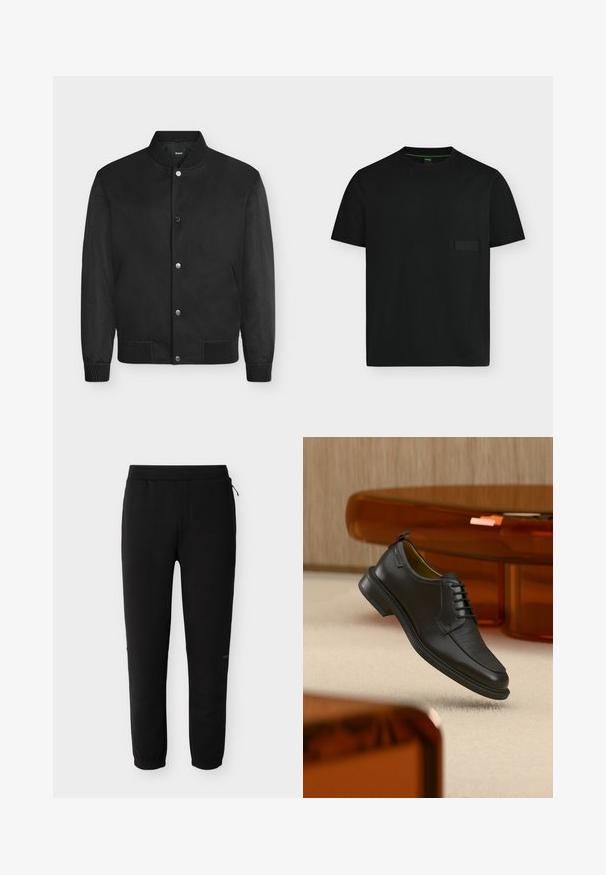 Blouson bomber noir avec col, poignets et ourlet côtelés, boutons-pression et manches texturées.; T-shirt noir à manches courtes et col rond avec un petit patch logo rectangulaire sur la poitrine gauche et une bordure intérieure verte au col.; Pantalon de jogging noir avec taille élastique et poignets aux chevilles, équipé d'une petite fermeture éclair latérale et d'un logo discret de la marque sur la jambe droite.; Chaussure habillée noire en cuir à lacets avec devant texturé, flottant au-dessus d'un tapis beige dans une pièce moderne avec des meubles teintés d'ambre.