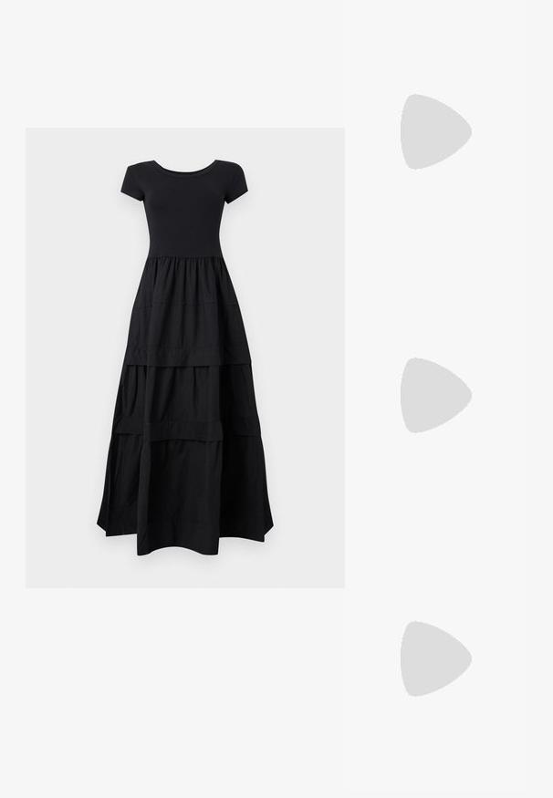 Robe maxi noire à manches courtes avec corsage cintré et jupe fluide à volants s'étendant jusqu'au sol sur un fond clair.; Ballerines noires en cuir avec un bout pointu, une semelle plate et une petite sangle avec un détail de boucle en argent.; Sac bandoulière rectangulaire en cuir noir avec bandoulière ajustable, fermeture éclair sur le dessus et petit logo Calvin Klein doré sur le devant.; Boucles d'oreilles en argent en forme de goutte avec des surfaces lisses, rondes et réfléchissantes, suspendues à des fermoirs à ressort. L'arrière-plan est blanc uni.