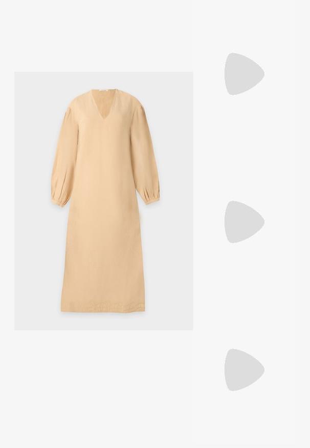 Beige long-sleeve midi dress with V-neck, gathered cuffs, and subtle embroidered detail along the hem on a light background.; Cream-colored women's pointed-toe low heel shoe with a round, ball-shaped heel on a plain background.; Small beige canvas tote bag with two wide black vertical straps, short handle, and adjustable shoulder strap with gold buckle.; Pair of gold-tone hoop earrings with ornate floral and leaf embossing on a neutral background.