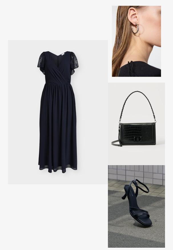 Longue robe noire avec manches courtes en dentelle, corsage croisé en V et taille froncée sur un fond uni.; Sandale noire à talon haut avec lanières et boucle à la cheville, flottant au-dessus d'un sol gris texturé avec un mur carrelé en arrière-plan.; Sac bandoulière en cuir noir à texture crocodile, de forme rectangulaire, avec une bandoulière ornée de chaînes et une fermeture à tourniquet à l'avant.; Boucle d'oreille en argent avec une finition polie, présentant de petits détails en or et de forme ronde, portée sur le lobe.