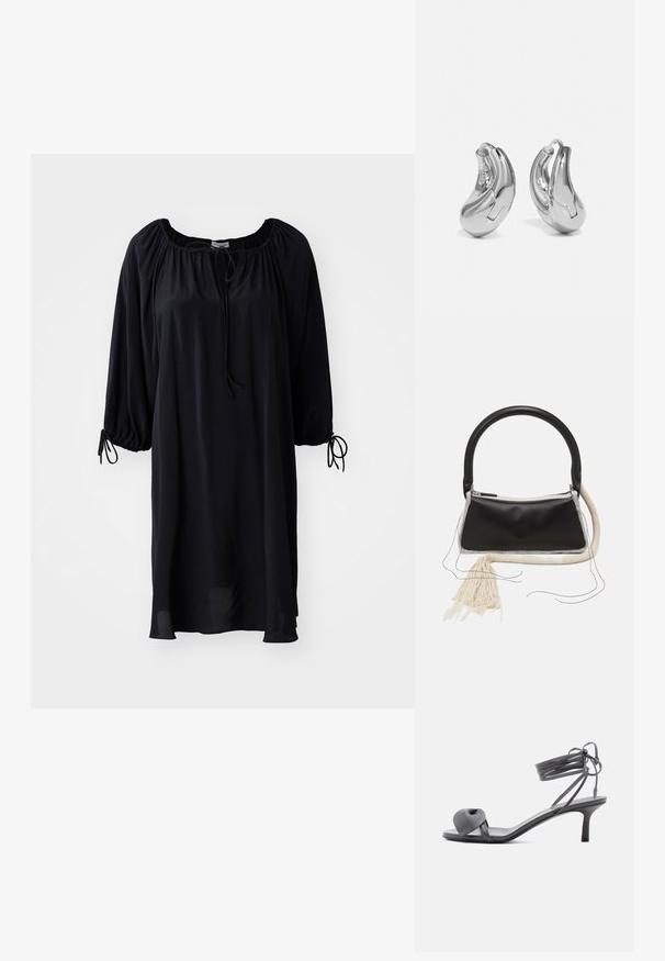 Robe noire, longueur genoux, avec un décolleté en U, un système de fermeture à cordon, et des manches bouffantes avec des détails à nouer aux poignets. Texture de tissu lisse.; Sandale à talon en cuir gris avec une bride nouée sur les orteils et des lacets enroulants autour de la cheville, sur un talon moyen et fin, sur fond blanc.; Sac en cuir noir avec une poignée arrondie, fermeture éclair en argent, bordure en fourrure blanche et un long gland crème attaché à l'avant.; Boucles d'oreilles en argent en forme de créoles avec une finition incurvée et brillante, et un design sans couture. Équipées d'une fermeture à charnière pour un port sécurisé.