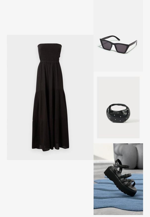 Μαύρο strapless maxi φόρεμα φτιαγμένο από υφασμάτινο υλικό, με σφηνοειδή μπούστο και διαστρωμένα τμήματα φούστας, προσφέροντας ρέουσα σιλουέτα.; Μαύρη πλατφόρμα σανδάλι με τρεις ρυθμιζόμενους ιμάντες με πόρπες, τοποθετημένη πάνω σε υφασμάτινο μπλε χαλί με θολό φόντο.; Μαύρα, γωνιώδη γυαλιά ηλίου με γκρι φακούς; κατασκευασμένα από πλαστικό, με χοντρές βραχίονες με λεία επιφάνεια και χωρίς ορατό μηχανισμό.; Μαύρη δερμάτινη τσάντα χειρός με στρογγυλεμένο σχήμα, διακοσμημένη με ασημένιες λεπτομέρειες με καρφιά και κοντή λαβή. Λείο υλικό και κλείσιμο με φερμουάρ.