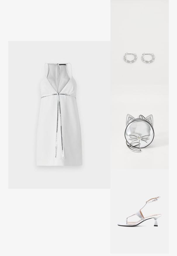 Vestido blanco sin mangas con un escote en V profundo, detalle de cremallera plateada y un acento de franjas horizontales texturizadas en la cintura. Acabado de tejido suave.; Sandalia plateada de tacón alto con tira en T y hebilla en el tobillo, decorada con pequeñas piedras brillantes, puntera abierta y tacón bajo.; Bolso circular plateado con orejas de gato, que presenta un tirador de cremallera en forma de corazón y detalles de bigotes sobre una superficie lisa y brillante.; Pendientes de aro de plata con acentos de perlas y cristales, con una superficie texturizada y un cierre de poste seguro.