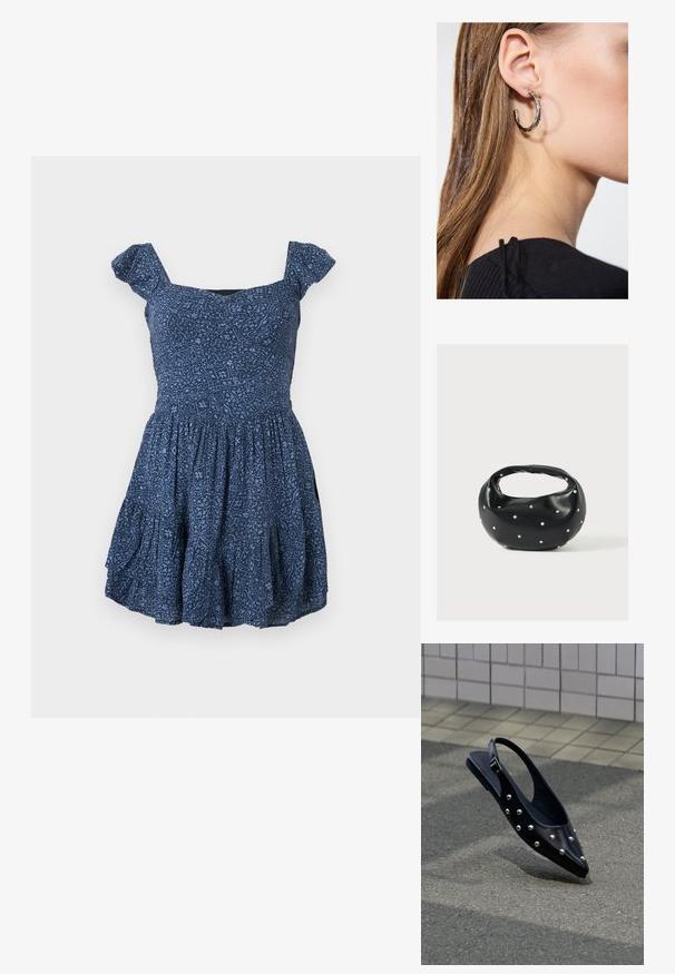 Vestido azul marino con tela estampada, escote cuadrado y mangas cortas abullonadas. Falda acampanada con detalles fruncidos.; Zapato slingback negro puntiagudo con tachuelas plateadas, flotando sobre el asfalto cerca de una pared con azulejos de fondo.; Bolso de mano de cuero negro con forma redondeada, decorado con detalles de tachuelas plateadas y un asa corta. Textura lisa y cierre con cremallera.; Pendiente de aro de plata con un acabado pulido, que presenta pequeños detalles en dorado y una forma redonda, llevado en el lóbulo.