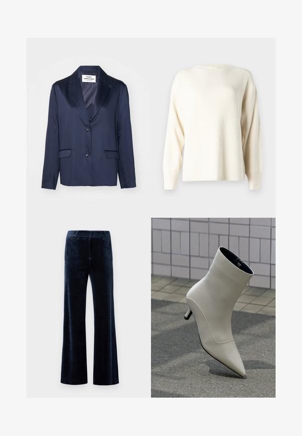 Navy blazer van gladde stof met een notch lapel, sluiting met één knoop en twee voorzakken. Kenmerkt zich door een eenvoudig, gestroomlijnd ontwerp.; Licht crèmekleurige geribbelde trui met een ronde halslijn, verlaagde schouders en lange mouwen. Gemaakt van zachte gebreide stof.; Marineblauwe flairbroek van zachte fluweel. Heeft een soepele textuur, een op maat gemaakte tailleband en strakke snijkanten. Geen zichtbare hardware of patronen.; Gebroken-witte leren enkellaars met spitse neus en lage kittenheel, rustend op straatstenen tegen een betegelde muur.
