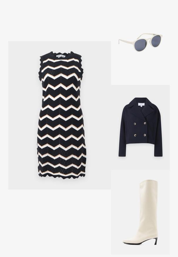Marineblå, cropped, dobbeltknaps jakke med krave, der har to forreste lommer og messingknapper, lavet af et blødt stof.; Ærmeløs sort strikket kjole med hvide og beige zigzag-striber, bølgede kanter og DKNY Jeans-mærke ved nakken.; Knæhøj hvid støvle lavet af glat materiale med spids tå og slank sort hæl. Har et enkelt design og minimal branding.; Hvide runde solbriller med mørke tonede linser og let buede skafter, der hviler på en hvid overflade.