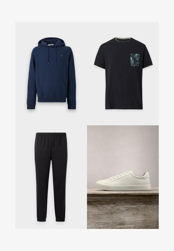 Marineblauwe ribgebreide hoodie met een kangaroezak aan de voorkant, een capuchon met trekkoord en een klein geborduurd embleem op de linkerborst.; Zwart T-shirt met korte mouwen, groene biezen aan de kraag en mouwen, en een donker bloemig patroon op het borstzakje aan de linkerkant.; Zwarte joggingbroek met elastische tailleband, taps toelopende benen en textuurstof. Voorzien van een subtiele logo detail aan de linkerkant.; Witte vetersneaker die boven een houten bank zweeft met groene bladeren op de achtergrond, waarbij het ontwerp en de textuur van de schoen worden getoond.