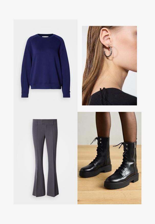 Navyblauwe sweatshirt, gemaakt van zachte stof, met een ronde halslijn, lange raglanmouwen en knopenaccenten bij de manchetten.; Grijze flared broek van soepel materiaal met een getailleerde pasvorm, met voorste kreuklijnen en een middelhoge tailleband.; Zwarte leren veterschoenen met chunky zolen, zijrits en metalen oogjes. Gladde afwerking met variërende textuur op de schacht.; Zilveren oorbel met een gepolijste afwerking, met kleine gouden accentdetails en een ronde vorm, gedragen op de oorlel.