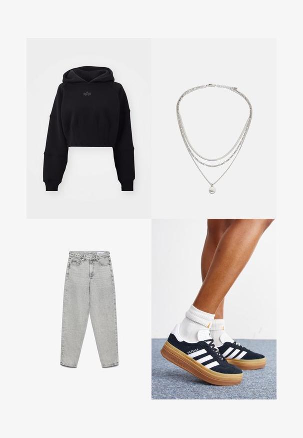 Korte zwarte hoodie van zachte stof met een geribde tailleband, oversized mouwen en een subtiele logo in het midden op de borst.; Lichtgrijze jeans met hoge taille en rechte pijpen, voorzakken, riemlussen en een ritssluiting.; Ben met witte sokken en zwarte Adidas Gazelle sneakers met witte strepen en dikke bruine zolen op een grijs tapijt.; Zilveren gelaagde ketting met meerdere kettingstijlen, waaronder een gladde ketting en een kralenketting, met een kleine ronde hanger.