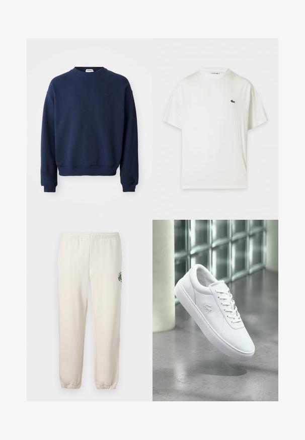 Marineblauwe trui met lange mouwen en ronde hals, geribde boorden en zoom, met een klein ton-sur-ton geborduurd logo op de linkerborst.; Witte T-shirt met korte mouwen en ronde hals en een klein groen krokodillenlogo op de linkerborst.; Lichtbeige sweatpants van katoen, met een elastische tailleband, geribde boorden en een groen logo met een bladerenontwerp op het linkerpand.; Witte lage sneaker met veterontwerp en geperst krokodillenlogo, geplaatst bovenop een grijze gepolijste vloer met glasblokmuur op de achtergrond.