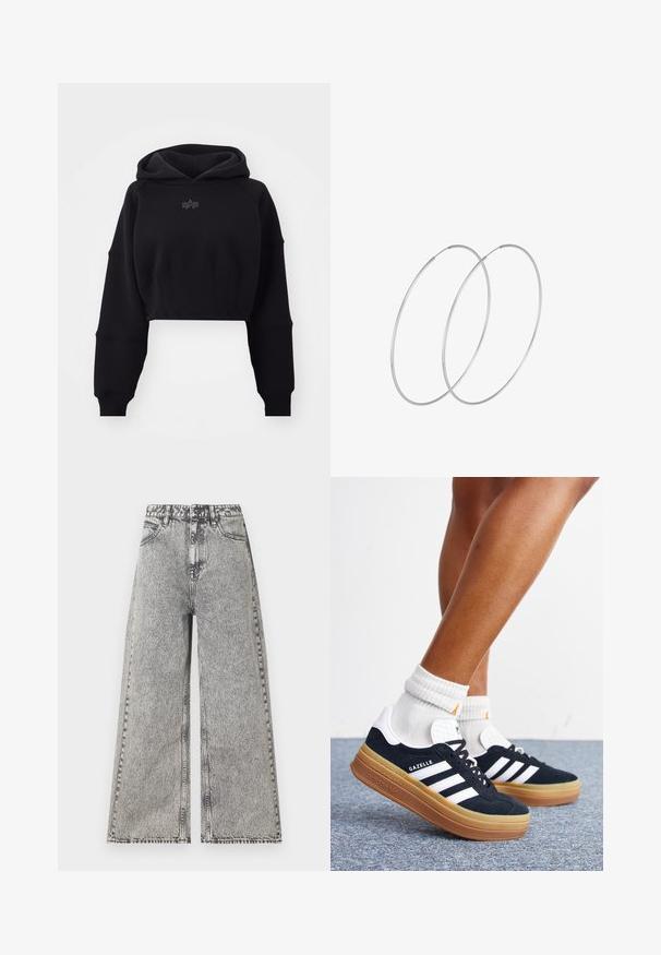 Forkortet sort hættebluse i blødt stof med ribbet talje, oversized ærmer og et diskret logo centreret på brystet.; Vidde jeans i falmet sort denim med høj talje, klassisk fem-lomme design og synlige syninger.; Ben iført hvide sokker og sorte Adidas Gazelle sneakers med hvide striber og tykke brune såler på et gråt tæppe.; Sølvøreringe med et minimalistisk design. Cirkulær form, glat tekstur og tynd profil. Letvægtige med en poleret overflade.