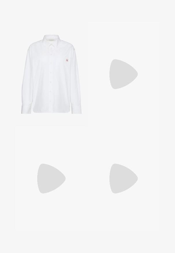 Camisa blanca de manga larga con botones, cuello puntiagudo y pequeño parche con el logo de Calvin Klein en el bolsillo izquierdo del pecho.; Pantalones marrones a medida con un corte recto, frente plisado y cinturilla clásica. Fabricados en un tejido suave con un acabado refinado.; Tacón destalonado negro con punta puntiaguda, acabado de satén elegante y tacón delgado de 3 pulgadas. Diseño lateral abierto con detalle mínimo de costuras.; Bolso de hombro de cuero color crema de Calvin Klein con borde superior curvado, cremallera plateada y correa ajustable marrón oscuro.