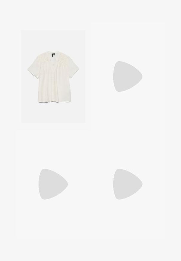Blouse blanche à manches courtes avec boutonnière sur le devant et broderie florale découpée aux épaules et en haut de la poitrine.; Short beige taille haute avec plis devant et une large ceinture tissée avec une grande boucle ronde en bois.; Chaussure plate noire à bout pointu avec bride arrière près d'une table ronde en bois avec des livres empilés sur un tapis beige dans un salon moderne.; Sac seau en paille tissée avec une base large, un sommet étroit et une bandoulière en cuir marron ajustable.