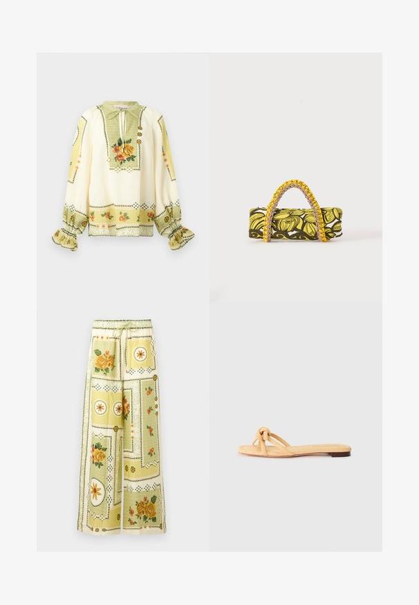 Crèmekleurige blouse met lange mouwen, geel-oranje bloemenprint, geplooide ruches aan de manchetten en een striknek met decoratieve knopen.; Wijde broek met lichtgele bloemen- en geometrische patchworkpatronen, met een elastische tailleband en trekkoord.; Geel geweven platte sandaal met twee kruislings geplaatste banden, een geknoopte detail aan de voorkant en een lage, bruine zool.; Rechthoekige tas met geel-zwart bloemenpatroon en gevlochten geel-roze handvat op witte achtergrond.
