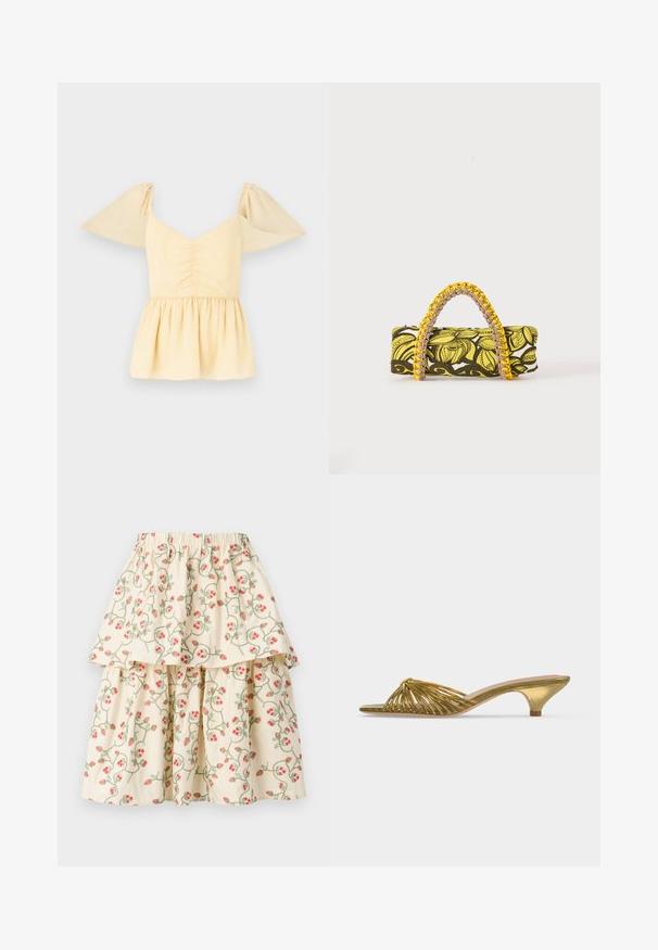 Top peplum de manga abullonada en suave algodón amarillo con un cuerpo fruncido y un dobladillo acampanado, con sutiles manchas a lo largo de la tela.; Falda de capas color crema con un patrón floral de fresas rojas y enredaderas verdes. Cintura elástica para mayor comodidad y ajuste.; Zapato mule dorado con tiras, puntera abierta, tacón bajo tipo kitten y diseño anudado sobre fondo blanco liso.; Bolsa rectangular con patrón floral en amarillo y negro y asa trenzada amarilla y rosa sobre fondo blanco.