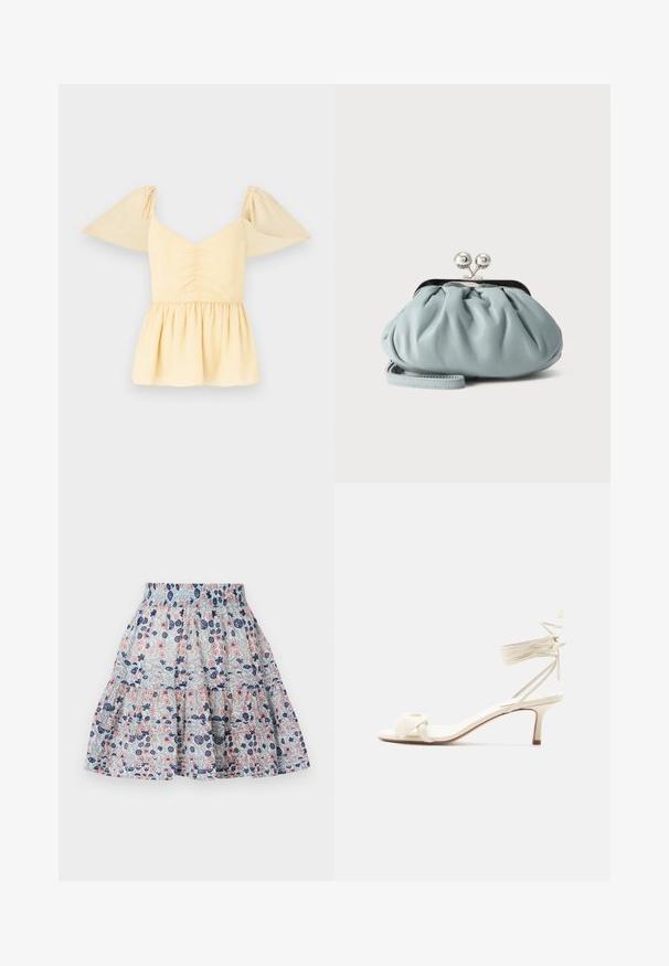 Top peplum de manga abullonada en suave algodón amarillo con un cuerpo fruncido y un dobladillo acampanado, con sutiles manchas a lo largo de la tela.; Falda de estampado floral en azul claro, con flores en tonos rosa y marino. Diseño en capas con una cinturilla elástica y tela suave y texturizada.; Sandalia de tacón bajo color crema con lazos alrededor del tobillo y una amplia tira retorcida sobre los dedos, sobre un fondo blanco liso.; Pequeño monedero de cuero azul claro con cierre metálico plateado tipo kiss-lock y correa corta para la muñeca sobre un fondo liso.