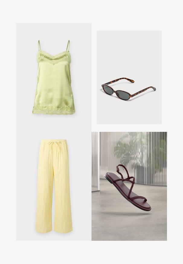 Camisole en satin vert clair avec bordure en dentelle le long de l'encolure, de l'ourlet et des côtés, dotée de fines bretelles réglables.; Pantalon jaune ample avec des rayures blanches verticales et une taille élastique dotée d'un cordon noué.; Sandale plate rouge bordeaux avec fines brides et boucle, flottant au-dessus d’un sol en béton dans un espace intérieur moderne avec des panneaux translucides verticaux.; Petites lunettes de soleil ovales en écaille avec des verres foncés reposant sur une surface gris clair.